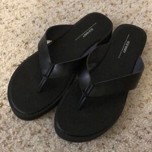 Black flip flop sandals